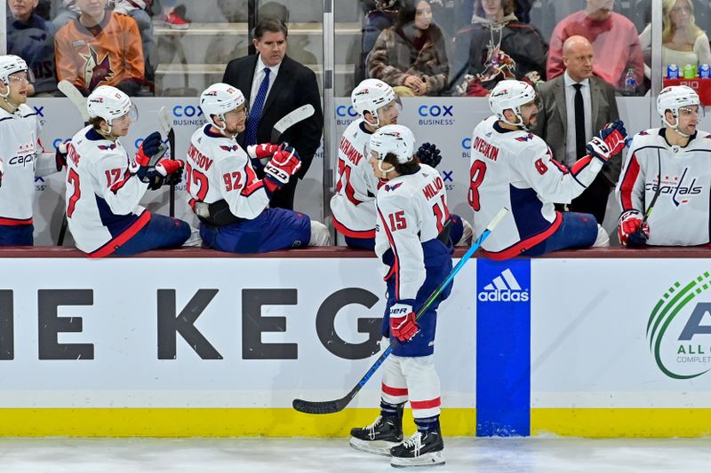 Jan 19, 2023; Tempe, Arizona, USA; Washington Capitals left wing Sonny Milano (15) celebrates with teammates after scoring a goal in the second period against the Arizona Coyotes at Mullett Arena. Mandatory Credit: Matt Kartozian-USA TODAY Sports