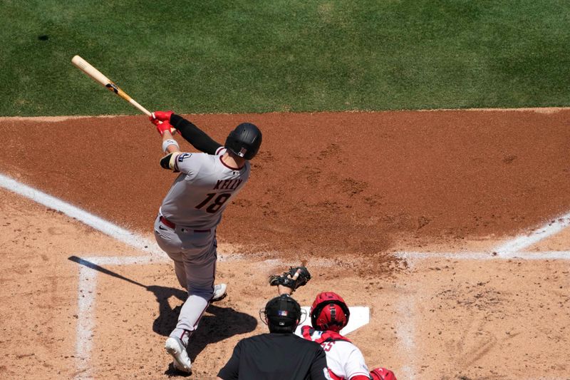 Jul 2, 2023; Anaheim, California, USA; Arizona Diamondbacks catcher Carson Kelly (18) hits a two-run home run in the second inning against the Los Angeles Angels at Angel Stadium. Mandatory Credit: Kirby Lee-USA TODAY Sports