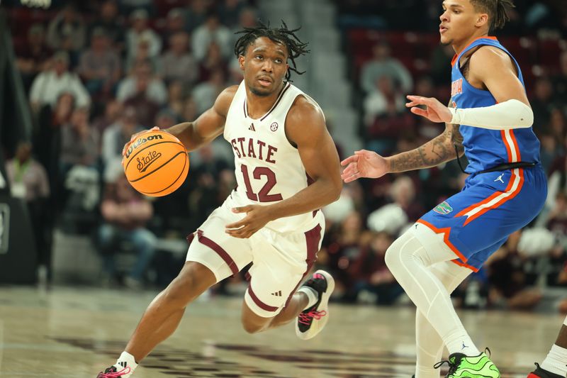 Feb 11, 2025; Starkville, Mississippi, USA; Mississippi State Bulldogs guard Josh Hubbard (12) handles the ball against the Florida Gators during the second half at Humphrey Coliseum. Mandatory Credit: Wesley Hale-Imagn Images