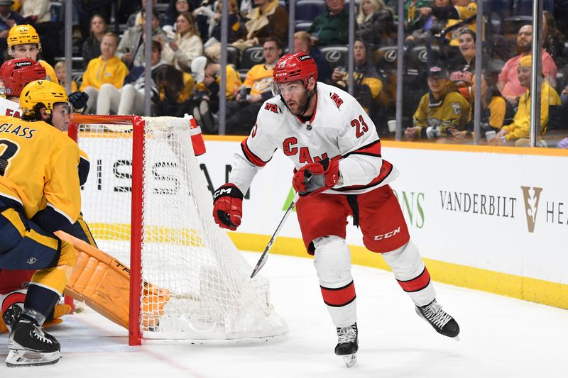 Dec 27, 2023; Nashville, Tennessee, USA; Carolina Hurricanes right wing Stefan Noesen (23) celebrates after scoring during the second period against the Nashville Predators at Bridgestone Arena. Mandatory Credit: Christopher Hanewinckel-USA TODAY Sports