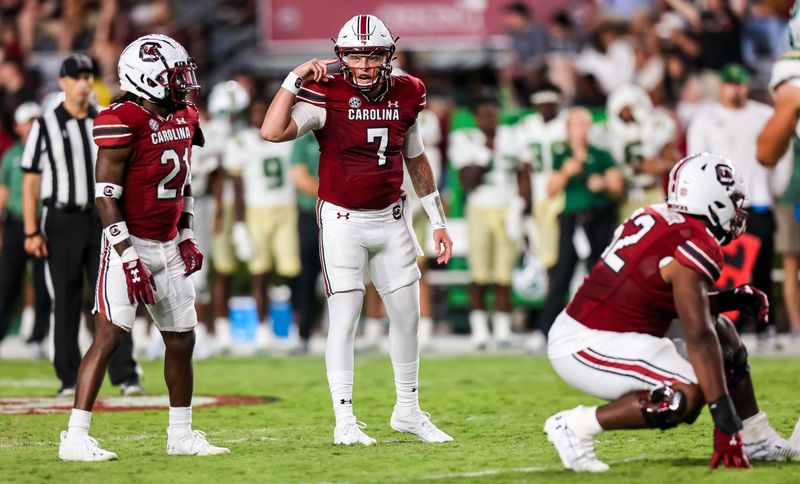 Sep 24, 2022; Columbia, South Carolina, USA; South Carolina Gamecocks quarterback Spencer Rattler (7) listens for the sideline call against the Charlotte 49ers in the second half at Williams-Brice Stadium. Mandatory Credit: Jeff Blake-USA TODAY Sports