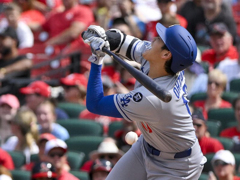 Jun 8, 2025; St. Louis, Missouri, USA;  Los Angeles Dodgers designated hitter Shohei Ohtani (17) reacts after he was hit by a pitch by St. Louis Cardinals relief pitcher Matt Svanson (not pictured) during the eighth inning at Busch Stadium. Mandatory Credit: Jeff Curry-Imagn Images