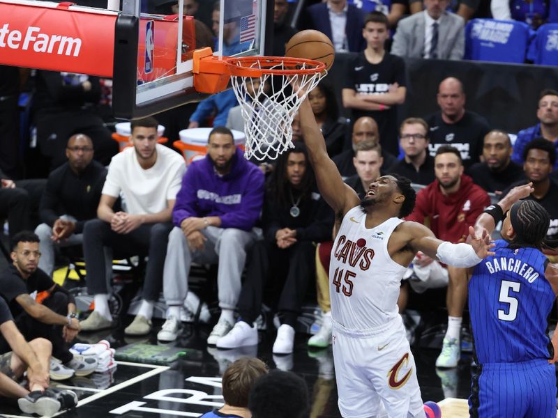 ORLANDO, FL - APRIL 27: Donovan Mitchell #45 of the Cleveland Cavaliers drives to the basket during the game against the Orlando Magic during Round 1 Game 4 of the 2024 NBA Playoffs on April 27, 2024 at the Kia Center in Orlando, Florida. NOTE TO USER: User expressly acknowledges and agrees that, by downloading and or using this photograph, User is consenting to the terms and conditions of the Getty Images License Agreement. Mandatory Copyright Notice: Copyright 2024 NBAE (Photo by David Sherman/NBAE via Getty Images)