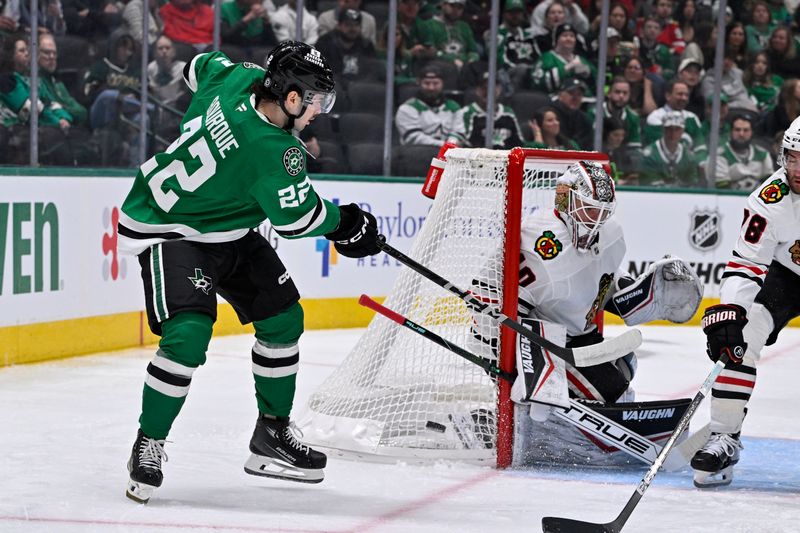 Nov 7, 2024; Dallas, Texas, USA; Chicago Blackhawks goaltender Arvid Soderblom (40) stops a shot by Dallas Stars center Mavrik Bourque (22) during the second period at the American Airlines Center. Mandatory Credit: Jerome Miron-Imagn Images