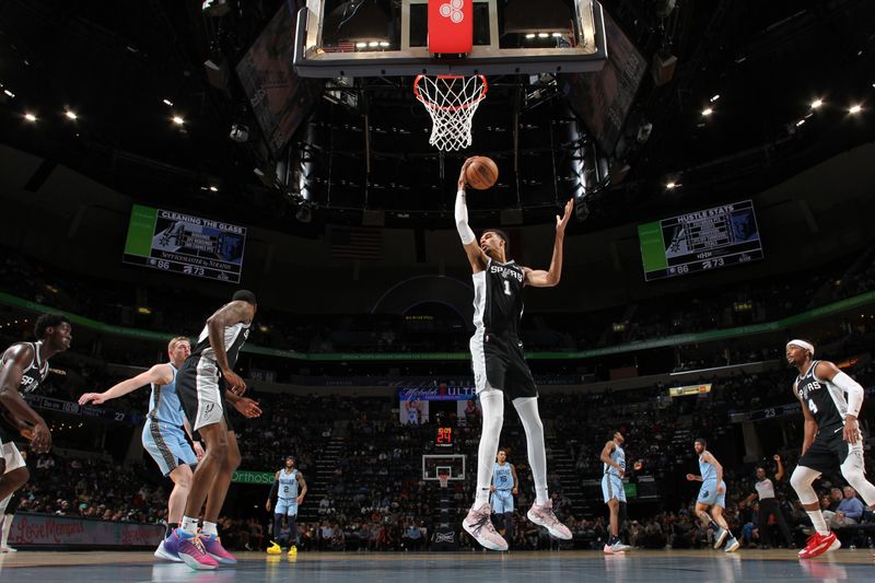 MEMPHIS, TN - APRIL 9: Victor Wembanyama #1 of the San Antonio Spurs grabs a rebound during the game against the Memphis Grizzlies on April 9, 2024 at FedExForum in Memphis, Tennessee. NOTE TO USER: User expressly acknowledges and agrees that, by downloading and or using this photograph, User is consenting to the terms and conditions of the Getty Images License Agreement. Mandatory Copyright Notice: Copyright 2024 NBAE (Photo by Joe Murphy/NBAE via Getty Images)