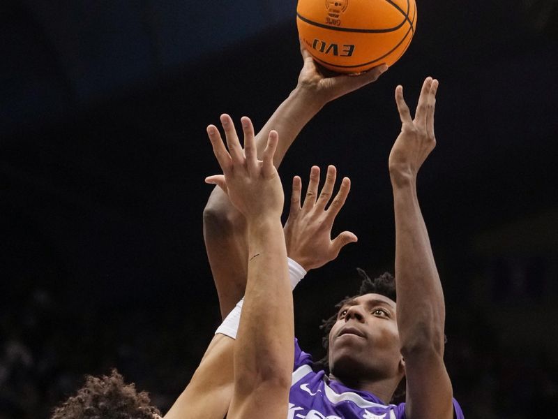 Jan 31, 2023; Lawrence, Kansas, USA; Kansas State Wildcats forward Nae'Qwan Tomlin (35) shoots over Kansas Jayhawks forward Jalen Wilson (10) during the first half at Allen Fieldhouse. Mandatory Credit: Jay Biggerstaff-USA TODAY Sports