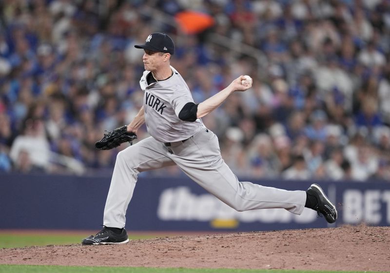 Jun 30, 2024; Toronto, Ontario, CAN; New York Yankees relief pitcher Tim Hill (54) throws pitch against theToronto Blue Jays during the seventh inning at Rogers Centre. Mandatory Credit: Nick Turchiaro-USA TODAY Sports