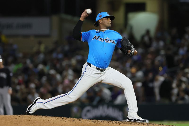 Mar 4, 2024; Jupiter, Florida, USA; Miami Marlins starting pitcher Edward Cabrera (27) delivers a pitch against the New York Yankees during the fourth inning at Roger Dean Chevrolet Stadium. Mandatory Credit: Sam Navarro-USA TODAY Sports