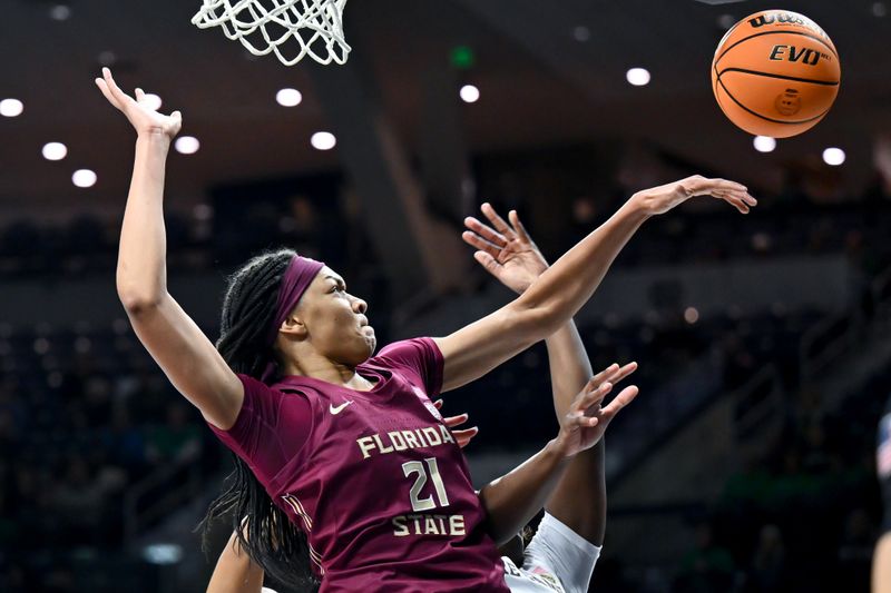 Jan 26, 2023; South Bend, Indiana, USA; Florida State Seminoles forward Makayla Timpson (21) blocks a shot in the second half against the Notre Dame Fighting Irish at the Purcell Pavilion. Mandatory Credit: Matt Cashore-USA TODAY Sports