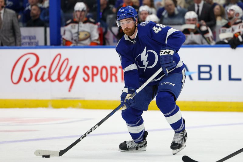 Jan 13, 2024; Tampa, Florida, USA;  Tampa Bay Lightning defenseman Nick Perbix (48) controls the puck against the Anaheim Ducks in the third period at Amalie Arena. Mandatory Credit: Nathan Ray Seebeck-USA TODAY Sports