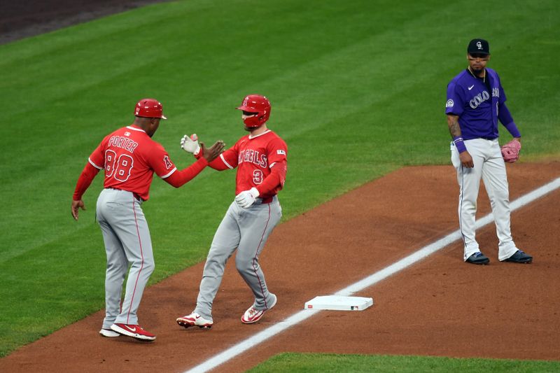 Sep 20, 2025; Denver, Colorado, USA; Los Angeles Angels outfielder Taylor Ward (3) is congratulated by third base coach Bo Porter (88) after a home run during the second inning against the Colorado Rockies at Coors Field. Mandatory Credit: Christopher Hanewinckel-Imagn Images