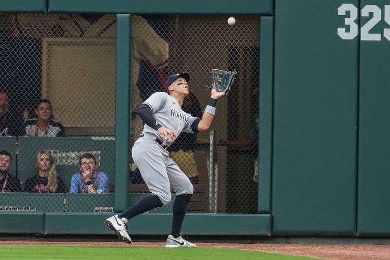 Aug 15, 2023; Cumberland, Georgia, USA; New York Yankees right fielder Aaron Judge (99) catches a fly ball hit by Atlanta Braves shortstop Orlando Arcia (11) (not shown) during the first inning at Truist Park. Mandatory Credit: Dale Zanine-USA TODAY Sports