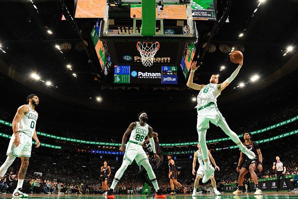 BOSTON, MA - DECEMBER 28: Kristaps Porzingis #8 of the Boston Celtics grabs a rebound during the game against the Detroit Pistons on December 28, 2023 at the TD Garden in Boston, Massachusetts. NOTE TO USER: User expressly acknowledges and agrees that, by downloading and or using this photograph, User is consenting to the terms and conditions of the Getty Images License Agreement. Mandatory Copyright Notice: Copyright 2023 NBAE  (Photo by Brian Babineau/NBAE via Getty Images)