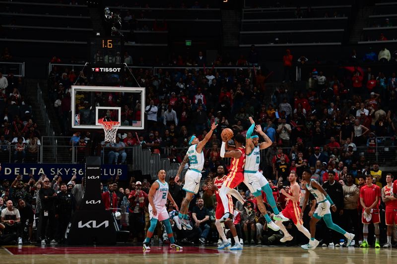 ATLANTA, GA - APRIL 10: Tre Mann #23 of the Charlotte Hornets blocks the shot by Trent Forrest #2 of the Atlanta Hawks to win the game on April 10, 2024 at State Farm Arena in Atlanta, Georgia.  NOTE TO USER: User expressly acknowledges and agrees that, by downloading and/or using this Photograph, user is consenting to the terms and conditions of the Getty Images License Agreement. Mandatory Copyright Notice: Copyright 2024 NBAE (Photo by Scott Cunningham/NBAE via Getty Images)