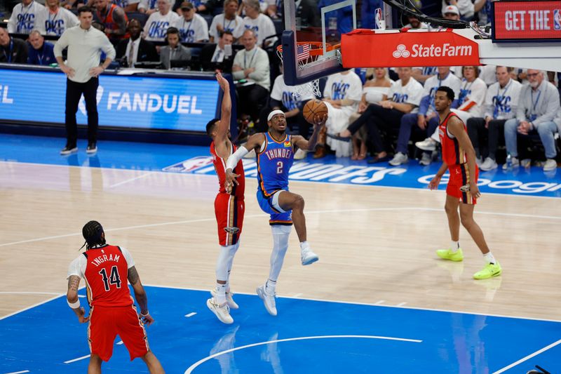 OKLAHOMA CITY, OK - APRIL 24: Shai Gilgeous-Alexander #2 of the Oklahoma City Thunder drives to the basket during the game against the New Orleans Pelicans during Round 1 Game 2 of the 2024 NBA Playoffs on April 24, 2024 at Paycom Arena in Oklahoma City, Oklahoma. NOTE TO USER: User expressly acknowledges and agrees that, by downloading and or using this photograph, User is consenting to the terms and conditions of the Getty Images License Agreement. Mandatory Copyright Notice: Copyright 2024 NBAE (Photo by Martin McGrew/NBAE via Getty Images)