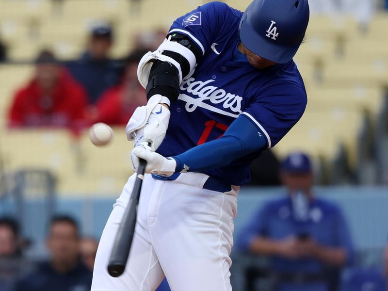 Mar 24, 2024; Los Angeles, California, USA;  Los Angeles Dodgers designated hitter Shohei Ohtani (17) flies out during the first inning against the Los Angeles Angels at Dodger Stadium. Mandatory Credit: Kiyoshi Mio-USA TODAY Sports