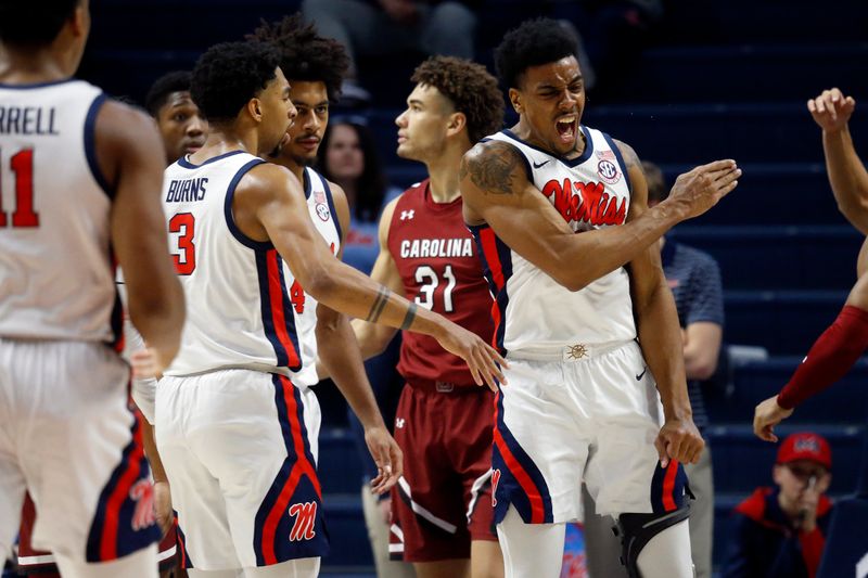 Feb 11, 2023; Oxford, Mississippi, USA; Mississippi Rebels forward Robert Allen (21) reacts with forward Myles Burns (3) during the first half against the South Carolina Gamecocks at The Sandy and John Black Pavilion at Ole Miss. Mandatory Credit: Petre Thomas-USA TODAY Sports