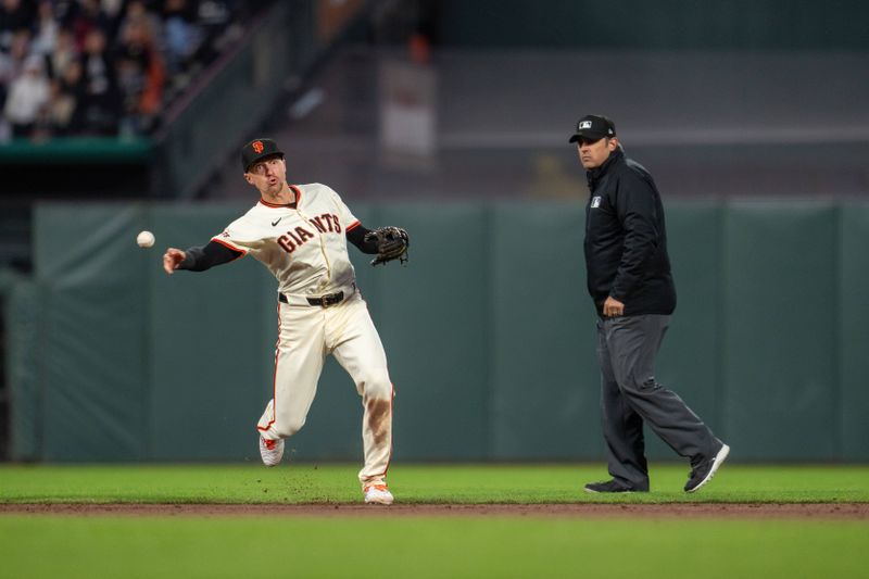 Apr 22, 2024; San Francisco, California, USA;  San Francisco Giants shortstop Nick Ahmed (16) throws out New York Mets designated hitter DJ Stewart (not pictured) at first base during the fifth inning at Oracle Park. Mandatory Credit: Neville E. Guard-USA TODAY Sports