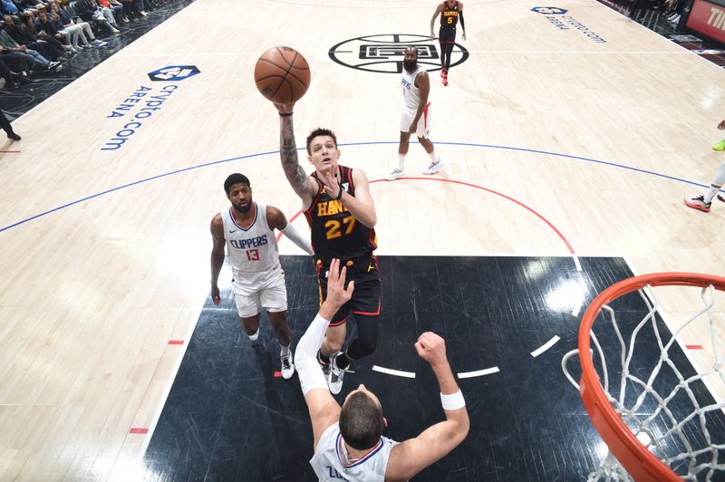 LOS ANGELES, CA - MARCH 17: Vit Krejci #27 of the Atlanta Hawks drives to the basket during the game against the LA Clippers on March 17, 2024 at Crypto.Com Arena in Los Angeles, California. NOTE TO USER: User expressly acknowledges and agrees that, by downloading and/or using this Photograph, user is consenting to the terms and conditions of the Getty Images License Agreement. Mandatory Copyright Notice: Copyright 2024 NBAE (Photo by Adam Pantozzi/NBAE via Getty Images)