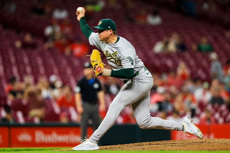 Aug 27, 2024; Cincinnati, Ohio, USA; Oakland Athletics relief pitcher Mason Miller (19) pitches against the Cincinnati Reds in the ninth inning at Great American Ball Park. Mandatory Credit: Katie Stratman-USA TODAY Sports