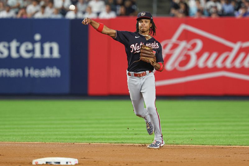 Aug 23, 2023; Bronx, New York, USA; Washington Nationals shortstop CJ Abrams (5) throws the ball to first base for an out \during the fourth inning against the New York Yankees during the second inning at Yankee Stadium. Mandatory Credit: Vincent Carchietta-USA TODAY Sports