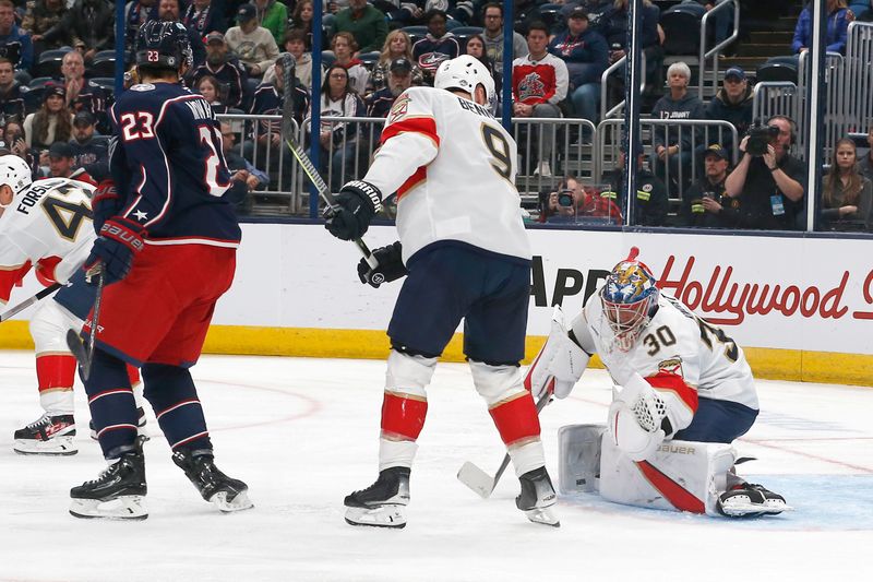 Oct 15, 2024; Columbus, Ohio, USA; Florida Panthers goalie Spencer Knight (30) makes a glove save against the Columbus Blue Jackets during the second period at Nationwide Arena. Mandatory Credit: Russell LaBounty-Imagn Images