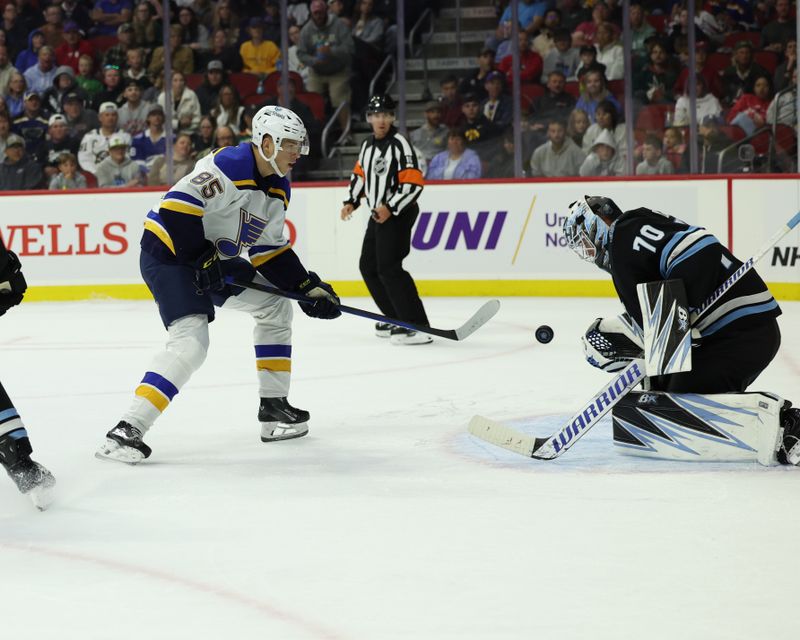 Sep 22, 2024; Des Moines, Iowa, USA;  St. Louis Blues goaltender Will Cranley (85) shoots against tUtah Hockey Club goaltender Karel Vejmelka (70) at Wells Fargo Arena. Mandatory Credit: Reese Strickland-Imagn Images

