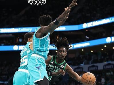 CHARLOTTE, NC - NOVEMBER 20: Jrue Holiday #4 of the Boston Celtics looks to pass the ball during the game against the Charlotte Hornets on November 20, 2023 at Spectrum Center in Charlotte, North Carolina. NOTE TO USER: User expressly acknowledges and agrees that, by downloading and or using this photograph, User is consenting to the terms and conditions of the Getty Images License Agreement.  Mandatory Copyright Notice:  Copyright 2023 NBAE (Photo by Brock Williams-Smith/NBAE via Getty Images)