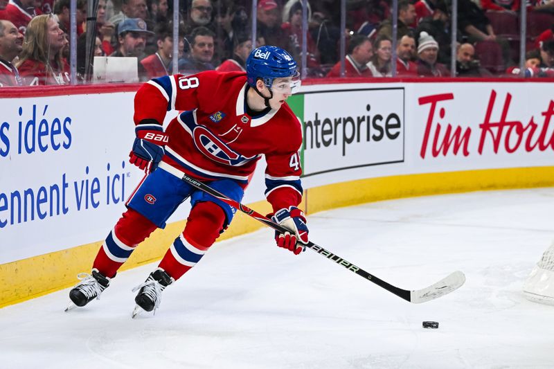 Dec 2, 2025; Montreal, Quebec, CAN; Montreal Canadiens defenseman Lane Hutson (48) plays the puck against the Ottawa Senators during the first period at Bell Centre. Mandatory Credit: David Kirouac-Imagn Images