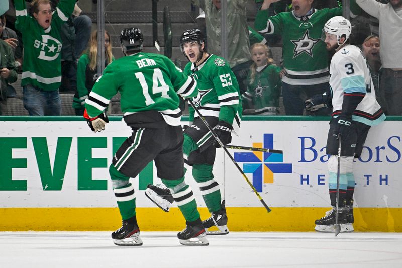 May 15, 2023; Dallas, Texas, USA; Dallas Stars center Wyatt Johnston (53) and left wing Jamie Benn (14) celebrate after Johnston scores the game winning goal against the Seattle Kraken during the third period in game seven of the second round of the 2023 Stanley Cup Playoffs at the American Airlines Center. Mandatory Credit: Jerome Miron-USA TODAY Sports