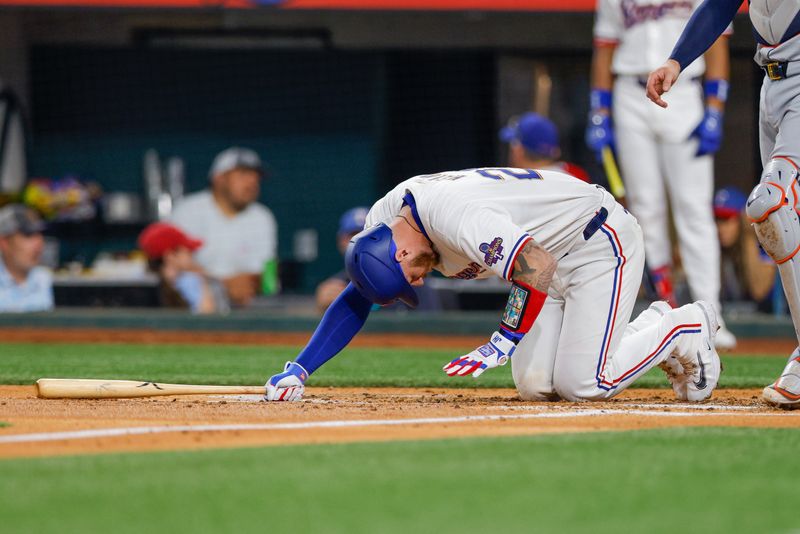 Jun 4, 2024; Arlington, Texas, USA; Texas Rangers catcher Jonah Heim (28) injures himself on a swing during the third inning against the Detroit Tigers at Globe Life Field. Mandatory Credit: Andrew Dieb-USA TODAY Sports