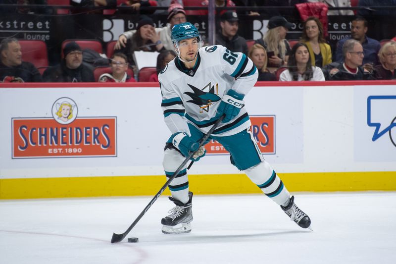 Jan 13, 2024; Ottawa, Ontario, CAN; San Jose Sharks right wing Kevin Leblanc (62) controls the puck against the Ottawa Senators in the first period at the Canadian Tire Centre. Mandatory Credit: Marc DesRosiers-USA TODAY Sports