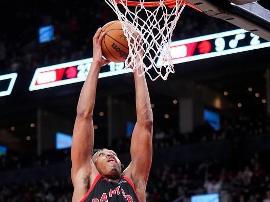 TORONTO, ON - DECEMBER 23: Scottie Barnes #4 of the Toronto Raptors dunks against the Utah Jazz during the first half of their basketball game at the Scotiabank Arena on December 23, 2023 in Toronto, Ontario, Canada. NOTE TO USER: User expressly acknowledges and agrees that, by downloading and/or using this Photograph, user is consenting to the terms and conditions of the Getty Images License Agreement. (Photo by Mark Blinch/Getty Images)