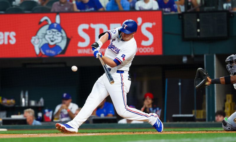 Jul 24, 2024; Arlington, Texas, USA; Texas Rangers shortstop Corey Seager (5) hits a home run during the first inning against the Chicago White Sox at Globe Life Field. Mandatory Credit: Kevin Jairaj-USA TODAY Sports