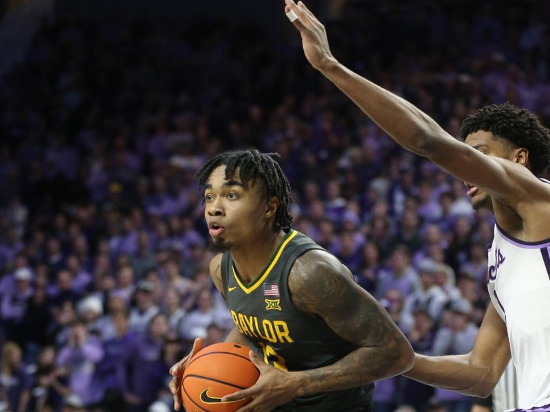 Jan 16, 2024; Manhattan, Kansas, USA; Baylor Bears guard Langston Love (13) is guarded by Kansas State Wildcats forward David N'Guessan (1) during the second half at Bramlage Coliseum. Mandatory Credit: Scott Sewell-USA TODAY Sports