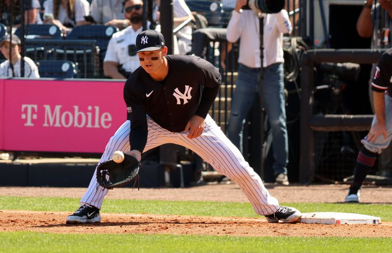 Feb 26, 2024; Tampa, Florida, USA;  New York Yankees first baseman Anthony Rizzo (48) catches a ball at first base during the second inning against the Minnesota Twins at George M. Steinbrenner Field. Mandatory Credit: Kim Klement Neitzel-USA TODAY Sports