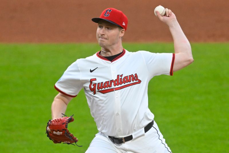 Apr 28, 2025; Cleveland, Ohio, USA; Cleveland Guardians relief pitcher Tim Herrin (29) delivers a pitch in the fifth inning against the Minnesota Twins at Progressive Field. Mandatory Credit: David Richard-Imagn Images