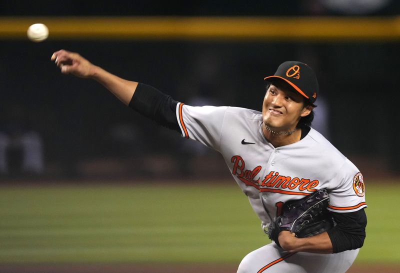 Sep 1, 2023; Phoenix, Arizona, USA; Baltimore Orioles relief pitcher Shintaro Fujinami (14) pitches against the Arizona Diamondbacks during the eighth inning at Chase Field. Mandatory Credit: Joe Camporeale-USA TODAY Sports