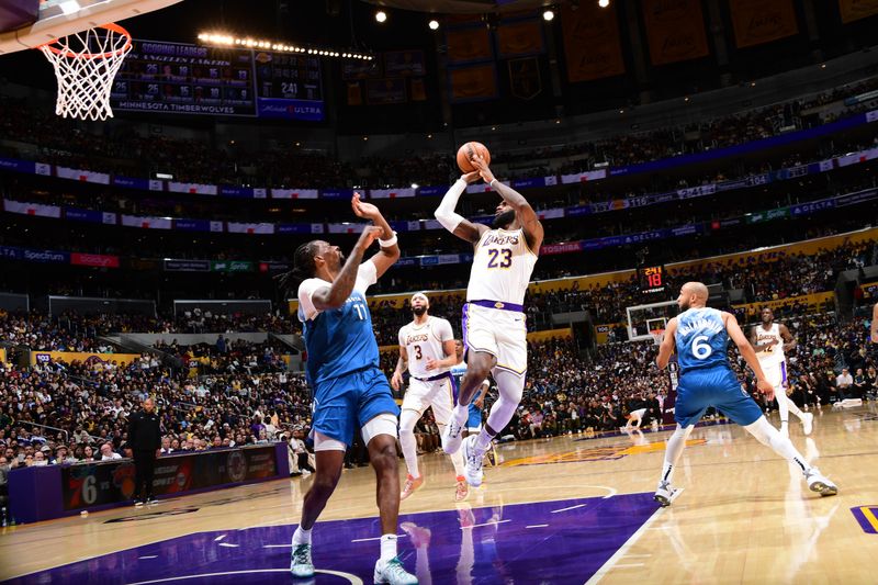 LOS ANGELES, CA - MARCH 10: LeBron James #23 of the Los Angeles Lakers drives to the basket during the game against the Minnesota Timberwolves on March 10, 2024 at Crypto.Com Arena in Los Angeles, California. NOTE TO USER: User expressly acknowledges and agrees that, by downloading and/or using this Photograph, user is consenting to the terms and conditions of the Getty Images License Agreement. Mandatory Copyright Notice: Copyright 2024 NBAE (Photo by Adam Pantozzi/NBAE via Getty Images)