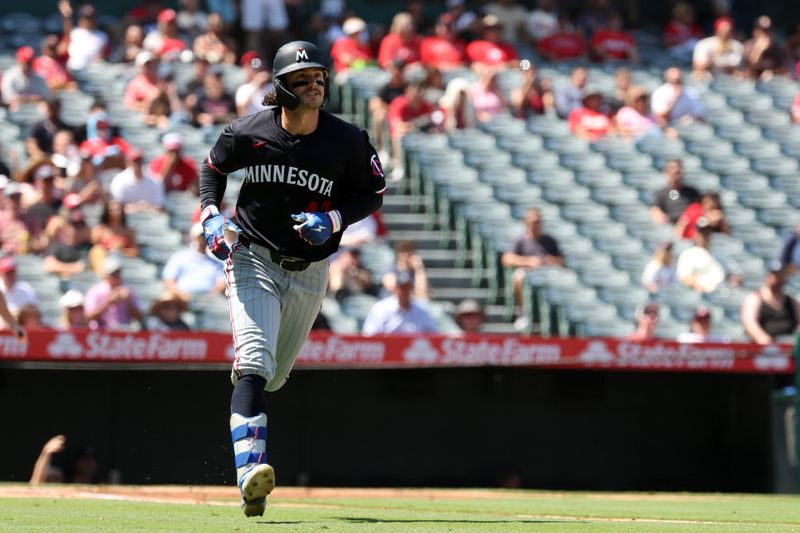 Sep 10, 2025; Anaheim, California, USA;  Minnesota Twins center fielder James Outman (43) hits a solo home run during the third inning against the Los Angeles Angels at Angel Stadium. Mandatory Credit: Kiyoshi Mio-Imagn Images