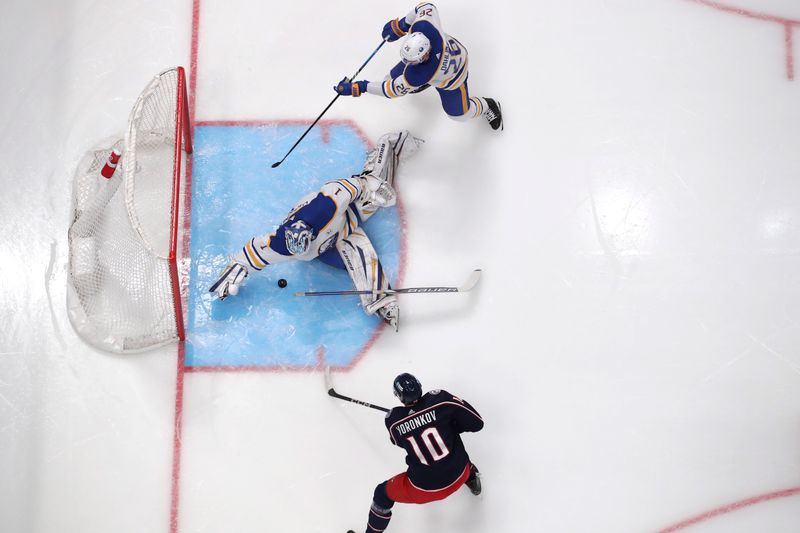 Feb 23, 2024; Columbus, Ohio, USA; Buffalo Sabres goalie Ukko-Pekka Luukkonen (1) makes a save from the shot of Columbus Blue Jackets left wing Dmitri Voronkov (10) during the first period at Nationwide Arena. Mandatory Credit: Russell LaBounty-USA TODAY Sports