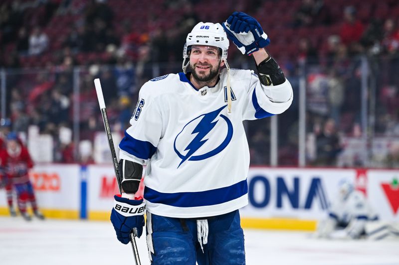 Apr 4, 2024; Montreal, Quebec, CAN; Tampa Bay Lightning right wing Nikita Kucherov (86) salutes fans in the crowd during warm-up before the game against the Montreal Canadiens at Bell Centre. Mandatory Credit: David Kirouac-USA TODAY Sports