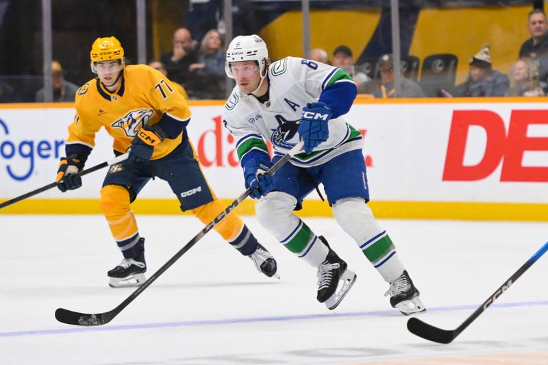 Oct 23, 2025; Nashville, Tennessee, USA;  Vancouver Canucks right wing Brock Boeser (6) skates with the puck against the Nashville Predators during the second period at Bridgestone Arena. Mandatory Credit: Steve Roberts-Imagn Images