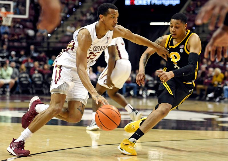 Feb 11, 2023; Tallahassee, Florida, USA; Florida State Seminoles guard Matthew Cleveland (35) works the ball around Pittsburgh Panthers guard Greg Elliott (3) during the first half at Donald L. Tucker Center. Mandatory Credit: Melina Myers-USA TODAY Sports