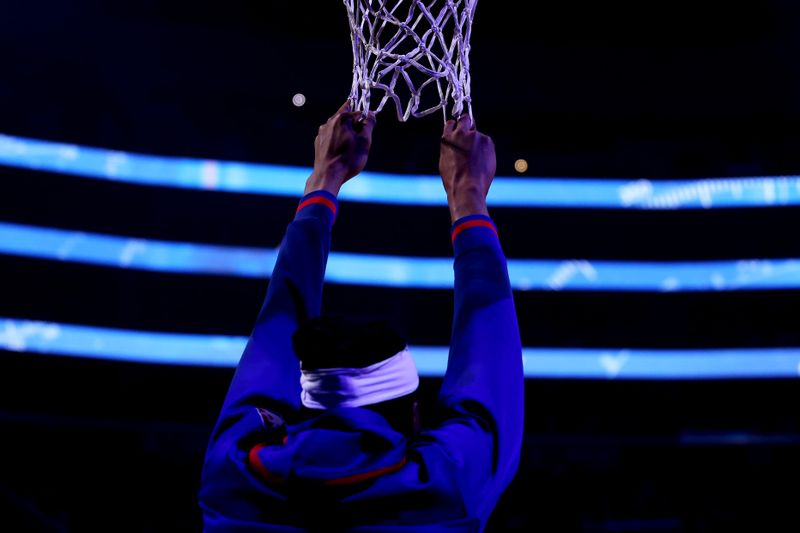 LOS ANGELES, CALIFORNIA - JANUARY 02: Moses Brown #6 of the Los Angeles Clippers holds onto the net during team introductions prior to the game against the Miami Heat at Crypto.com Arena on January 02, 2023 in Los Angeles, California. NOTE TO USER: User expressly acknowledges and agrees that, by downloading and or using this photograph, User is consenting to the terms and conditions of the Getty Images License Agreement. (Photo by Katelyn Mulcahy/Getty Images)