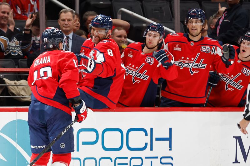 Sep 27, 2024; Washington, District of Columbia, USA; Washington Capitals forward Jakob Vrana (13) celebrates with Capitals left wing Alex Ovechkin (8) after scoring a goal against the Columbus Blue Jackets in the first period at Capital One Arena. Mandatory Credit: Geoff Burke-Imagn Images