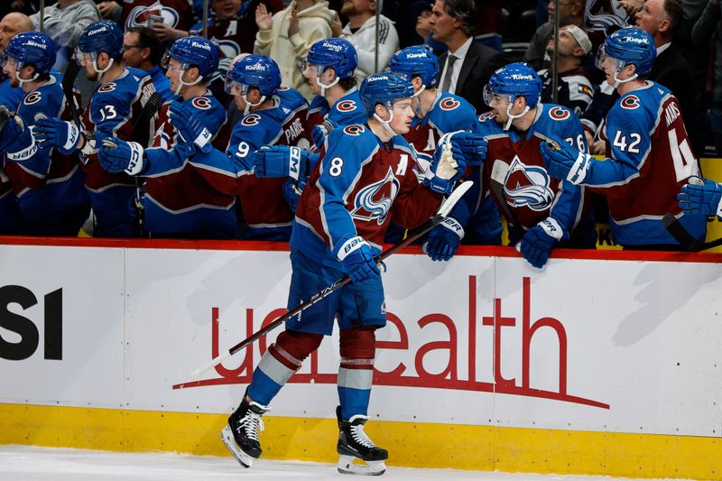 Mar 22, 2024; Denver, Colorado, USA; Colorado Avalanche defenseman Cale Makar (8) celebrates with the bench after his goal in the first period against the Columbus Blue Jackets at Ball Arena. Mandatory Credit: Isaiah J. Downing-USA TODAY Sports