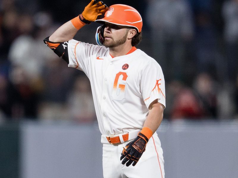 Jun 25, 2024; San Francisco, California, USA; San Francisco Giants shortstop Brett Wisely (0) gestures after hitting a double against the Chicago Cubs during the eighth inning at Oracle Park. Mandatory Credit: John Hefti-USA TODAY Sports