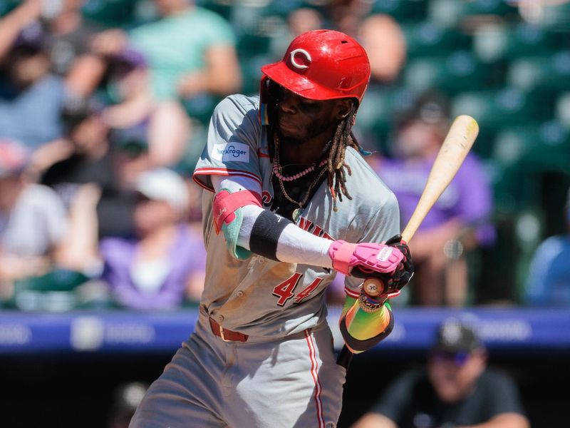 Jun 5, 2024; Denver, Colorado, USA; Cincinnati Reds shortstop Elly De La Cruz (44) hits an RBI single during the seventh inning against the Colorado Rockies at Coors Field. Mandatory Credit: Andrew Wevers-USA TODAY Sports