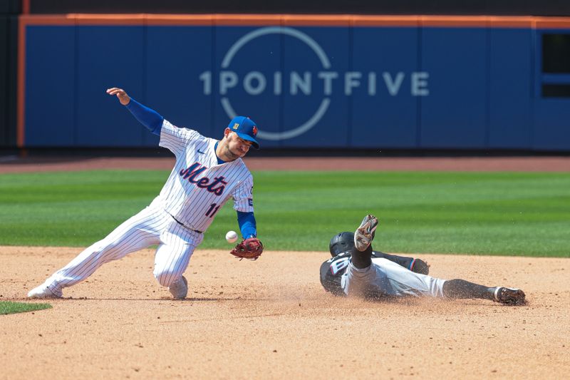 Aug 18, 2024; New York City, New York, USA; Miami Marlins shortstop Xavier Edwards (63) steals second base in front of New York Mets second baseman Jose Iglesias (11) during the eighth inning at Citi Field. Mandatory Credit: Vincent Carchietta-USA TODAY Sports